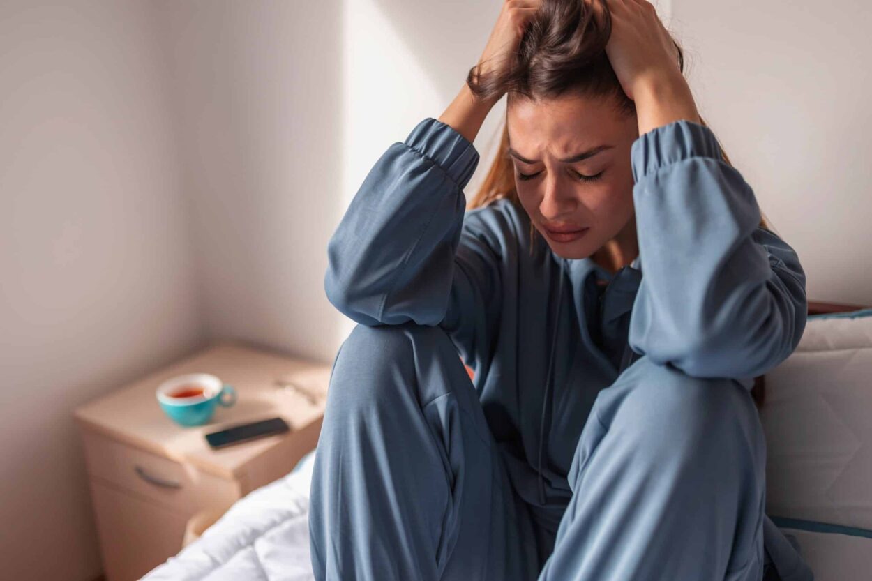 anxious woman crying in bed 2022 04 25 13 59 22 utc min scaled e1670510420959