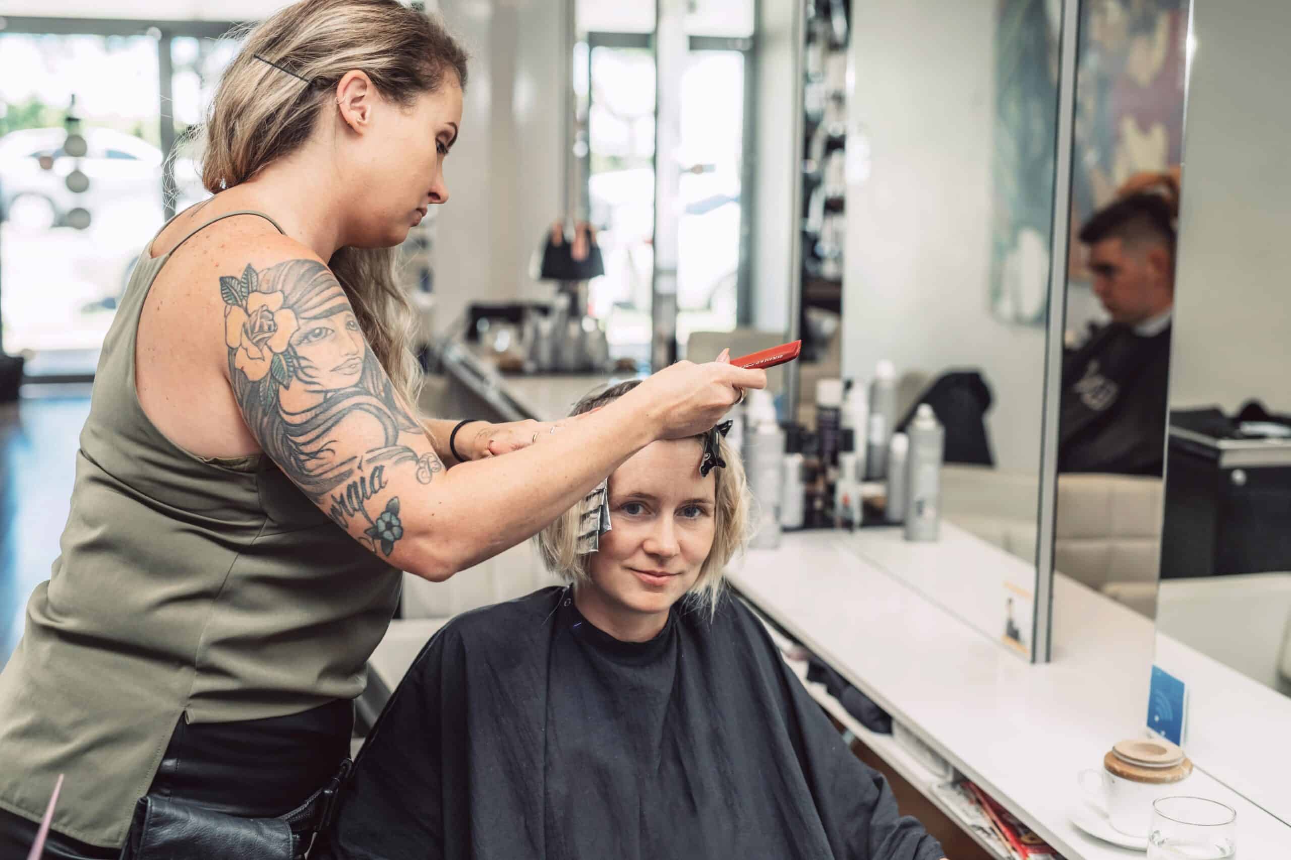 hairdresser colouring woman s hair in salon 2022 11 03 08 51 41 utc min scaled