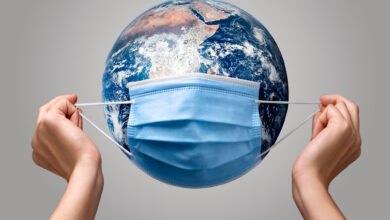 1694778661 person putting medical mask earth